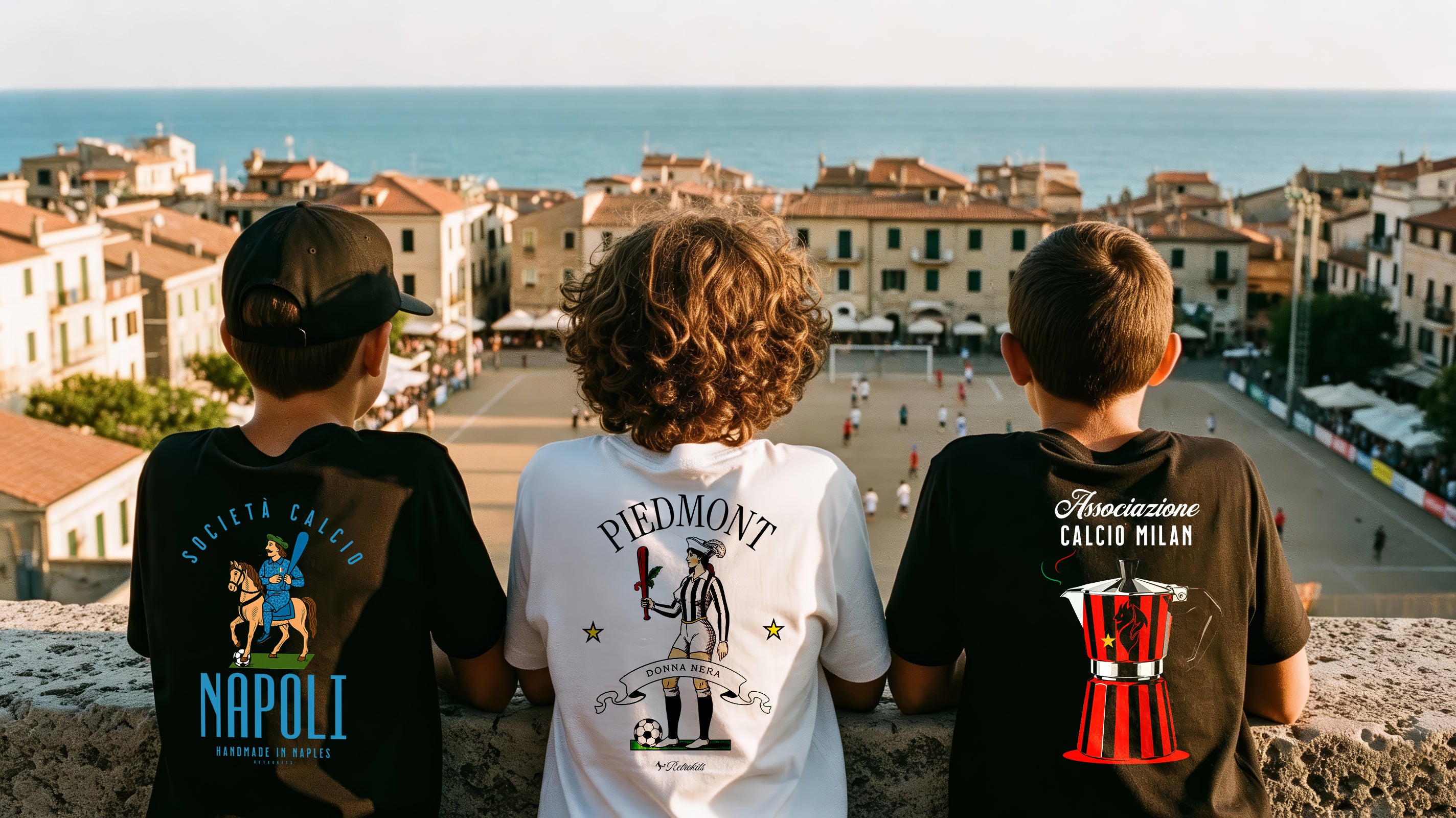 Three children wearing sports jerseys with team logos overlooking a coastal town.